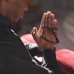 Catholic with rosary praying