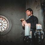 Priest reading and praying in the church