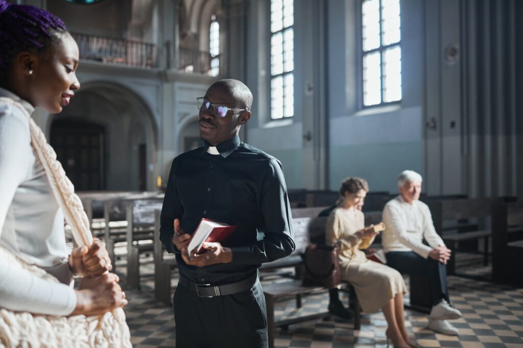 Priest talking to the faithful people