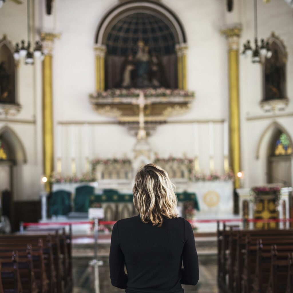 Woman praying in the church